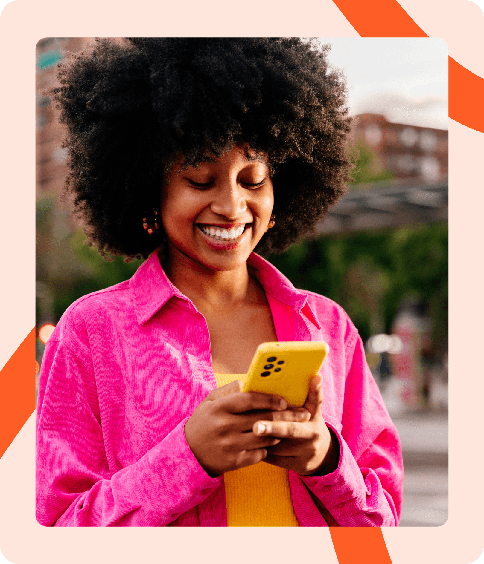 Creator smiling at her phone after sharing her storefront link