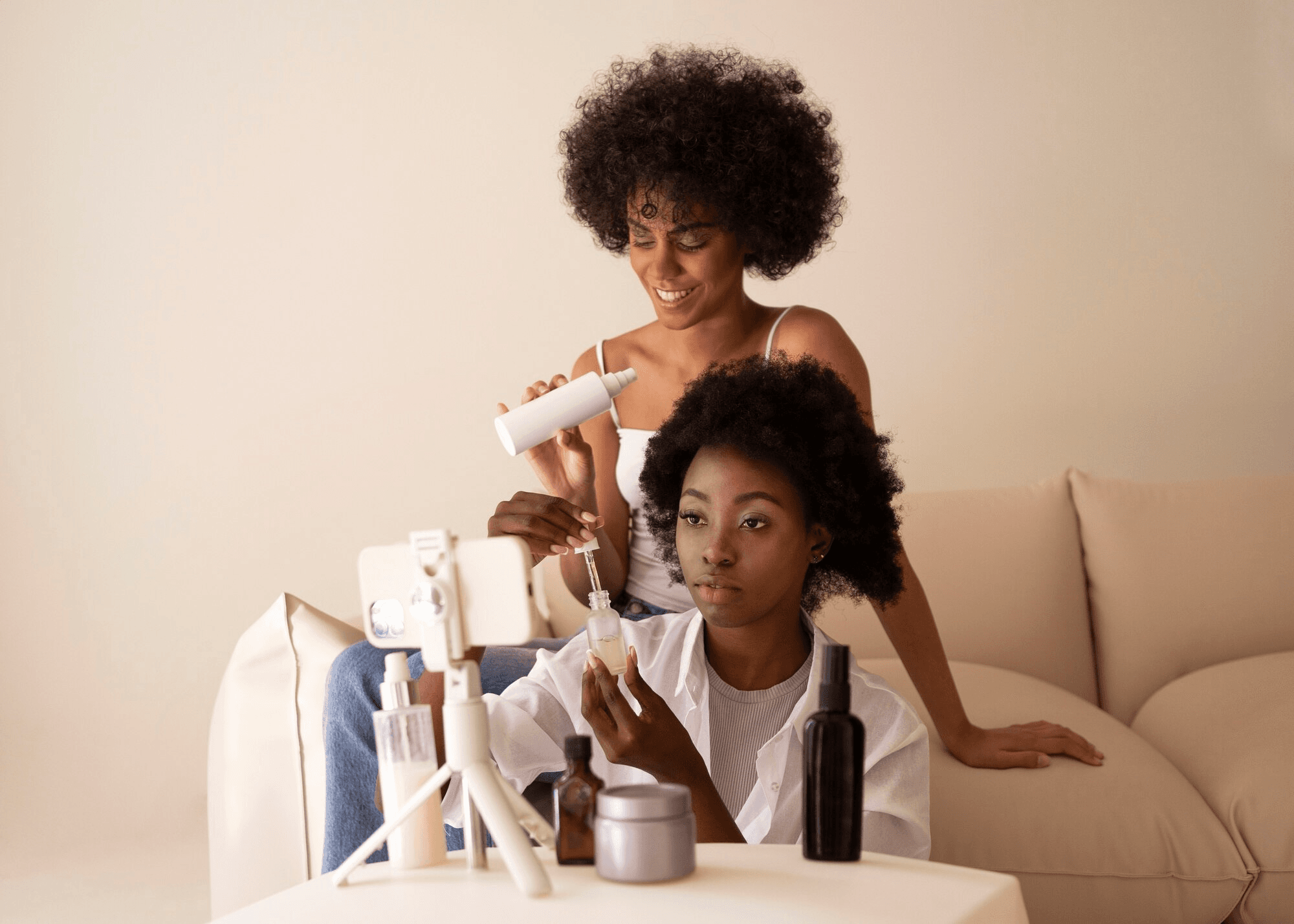 Two creators filming UGC content for a skincare brand campaign